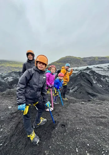 Family geared up for a glacier hike at Sólheimajökull in Iceland.