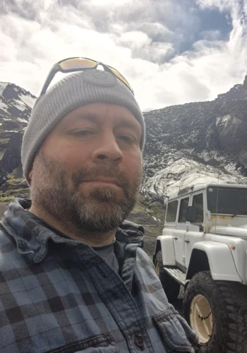 Otto the Viking selfie beside a white 4x4 in Thórsmörk, Iceland.