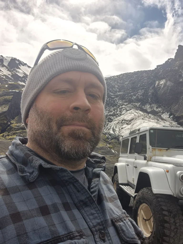 Otto the Viking selfie beside a white 4x4 in Thórsmörk, Iceland.